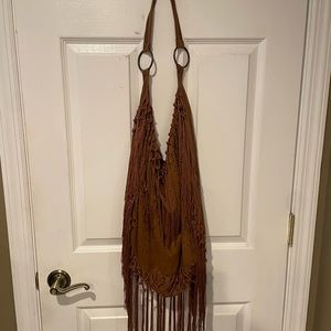 Hobo style fringe suede shoulder bag..